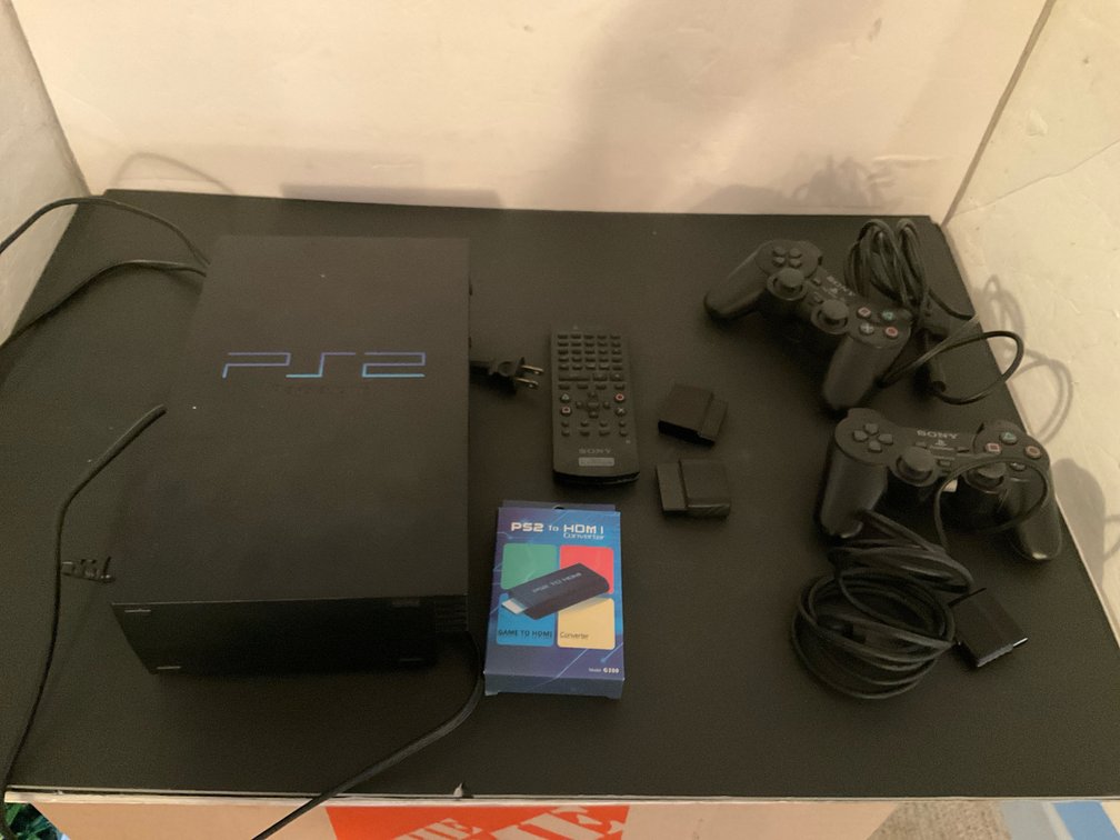 Sony PlayStation 2 console with controllers & accessories - Basement Living & Bar Area