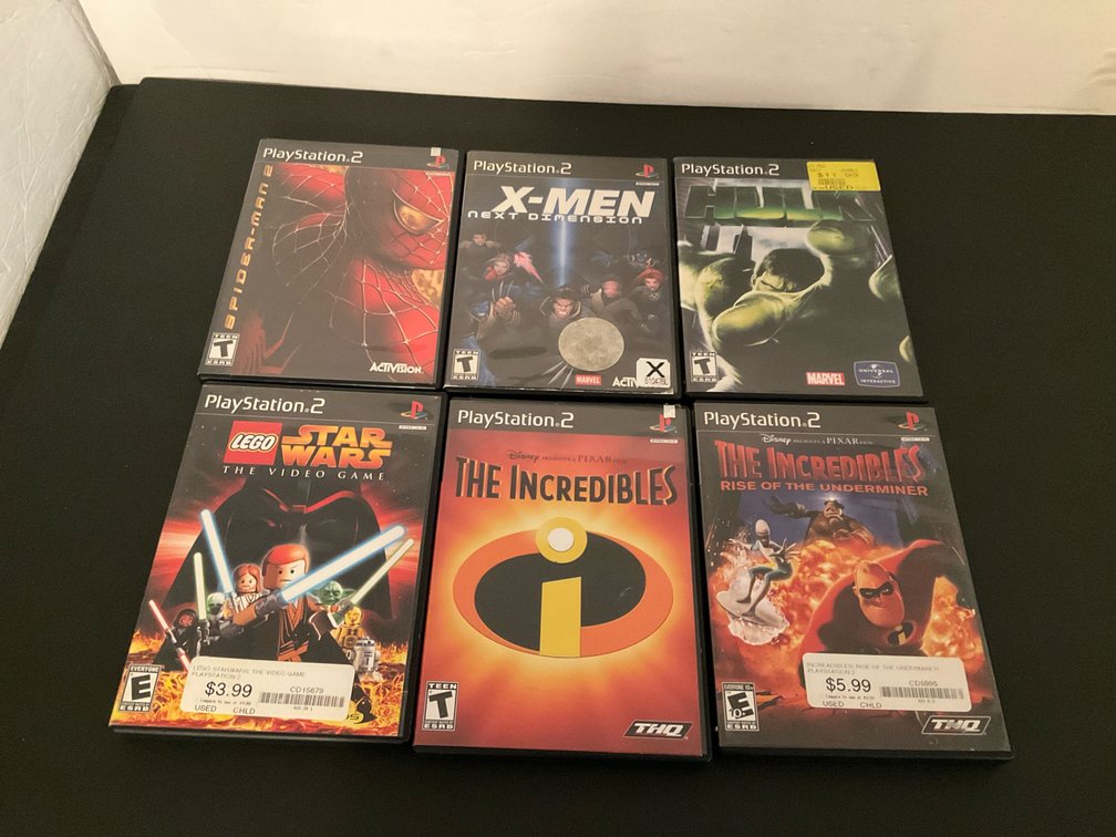PlayStation video games in cases - Basement Living & Bar Area