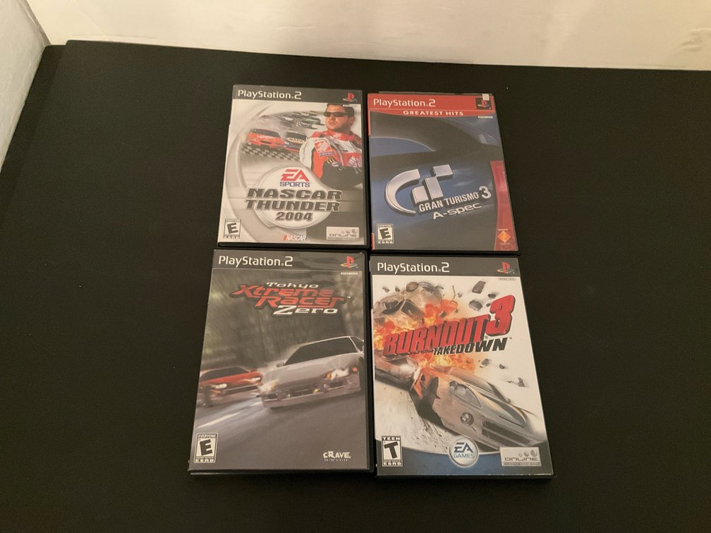PlayStation video games with Gran Turismo 3 & Burnout 3 - Basement Living & Bar Area