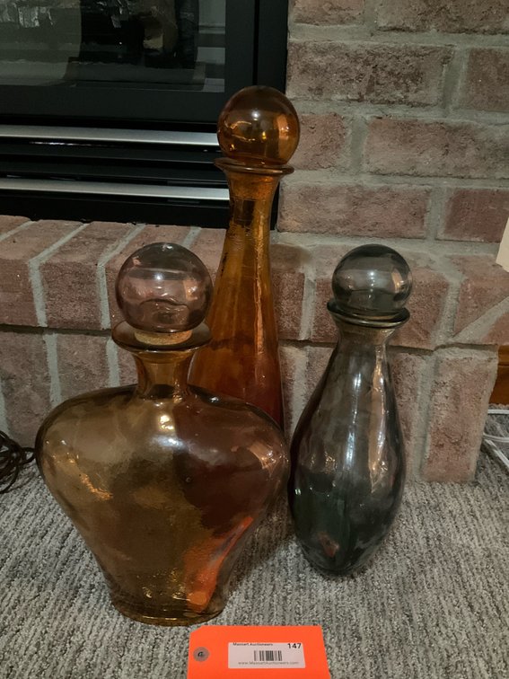 3 colored glass decanters with round stoppers - Basement Living & Bar Area
