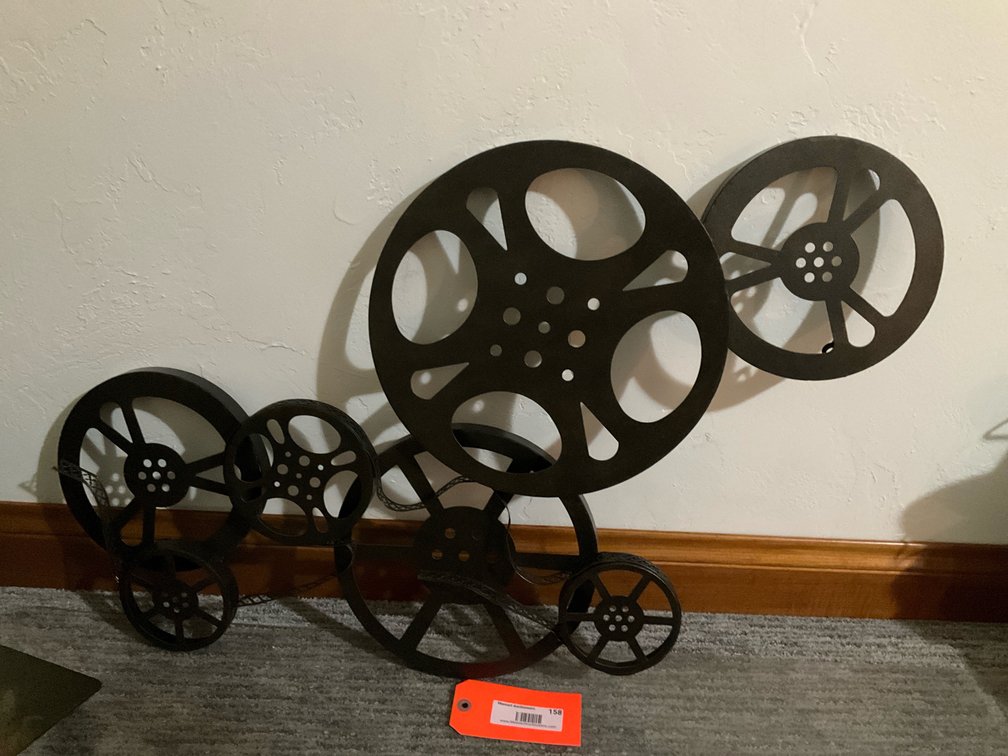 Bronze-tone metal film reel wall sculpture - Basement Living & Bar Area