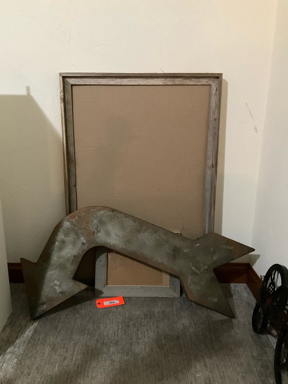 Curved metal arrow sign & 2 rustic wood frames - Basement Living & Bar Area