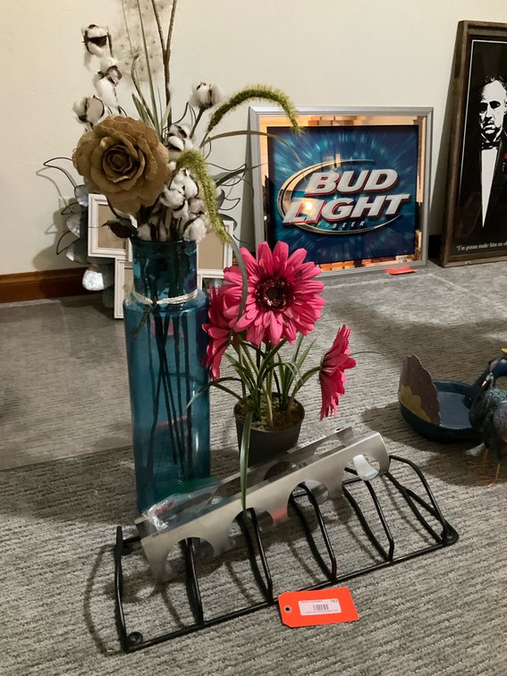 Metal organizer racks & artificial floral decor - Basement Living & Bar Area