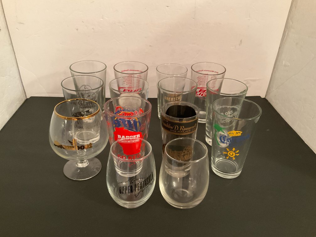 Assorted promotional & souvenir glasses - Basement Living & Bar Area