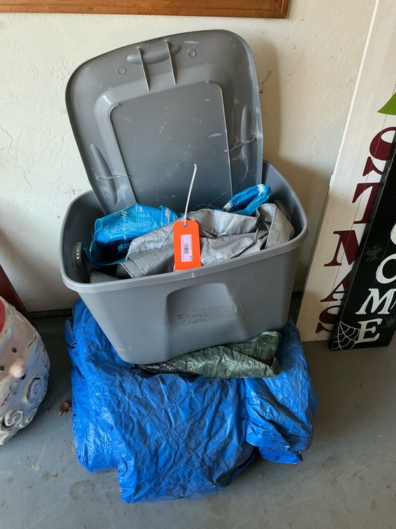 Gray plastic storage tote with lid & assorted poly tarps - Garage