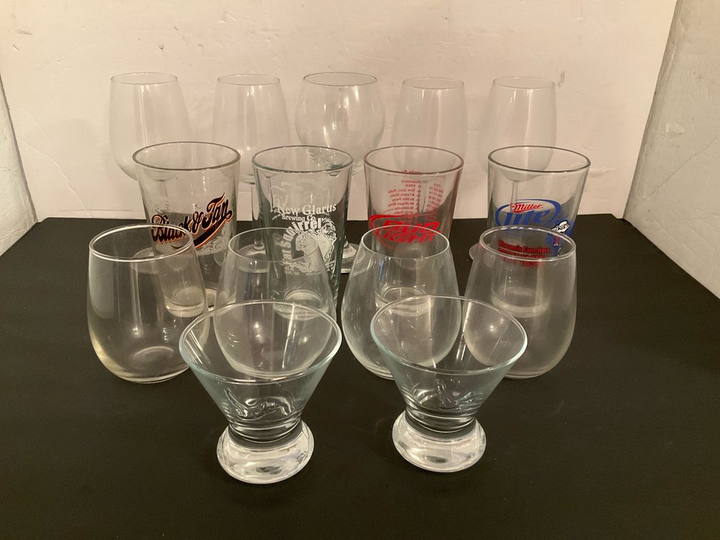 Assorted drinking glasses, pint glasses & stemware - Basement Living & Bar Area