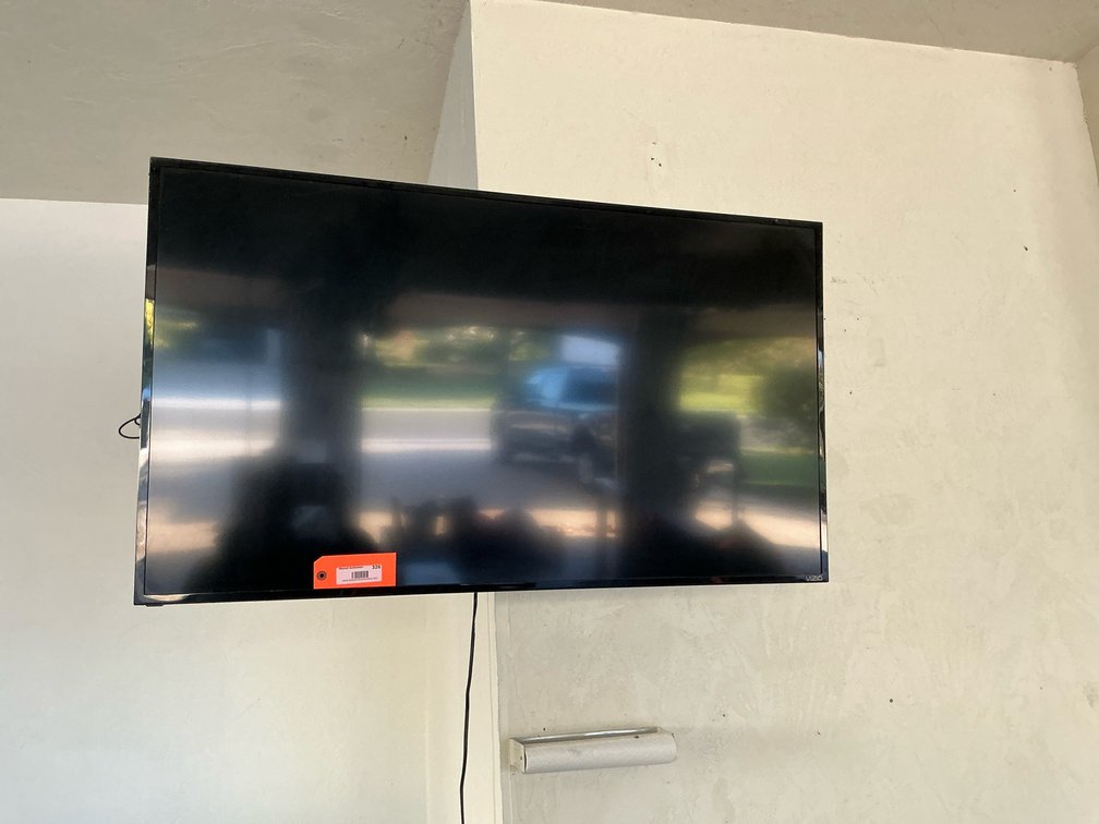 VIZIO 50” flat screen TV with remote & wall mount - Garage