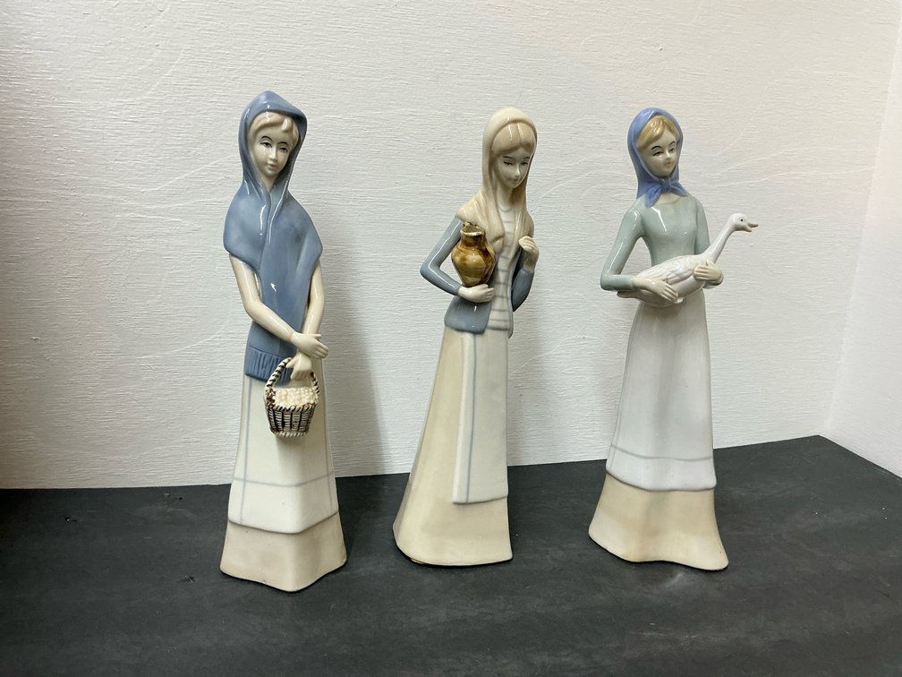 Glazed porcelain figurines of women