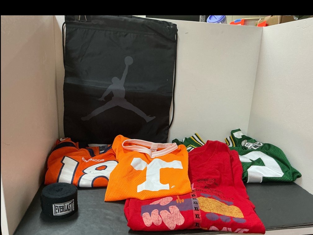 Grouping of sports jerseys, apparel & accessories