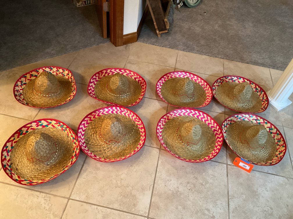 8 woven straw sombreros with patterned brims - Basement Living & Bar Area