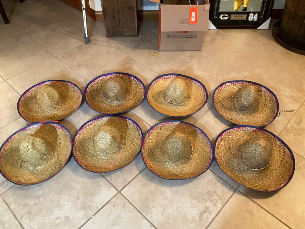Assorted woven straw sombreros - Basement Living & Bar Area
