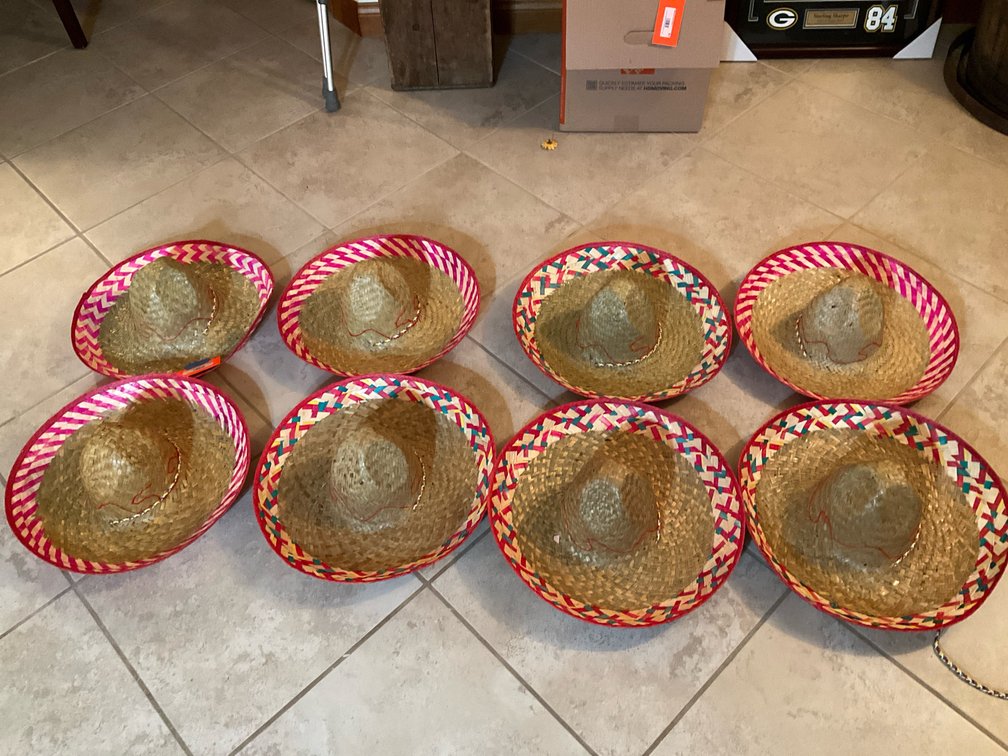 8 woven straw sombreros with patterned brims - Basement Living & Bar Area