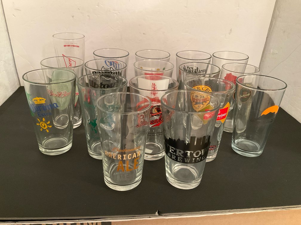 Grouping of brewery & beer pint glasses - Basement Living & Bar Area