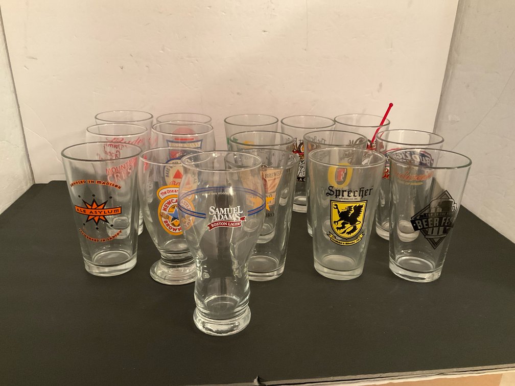 Grouping of assorted brewery beer glasses - Basement Living & Bar Area