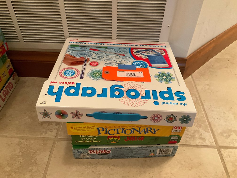 Grouping of 4 boxed games with Spirograph & Pictionary - Basement Living & Bar Area