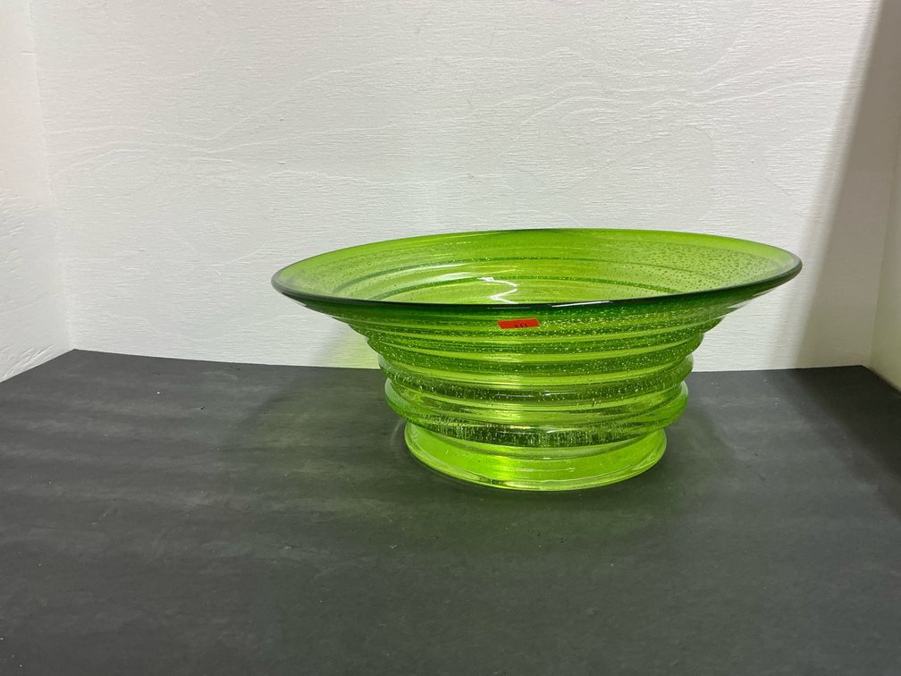 Lime green ribbed art glass bowl with controlled bubbles