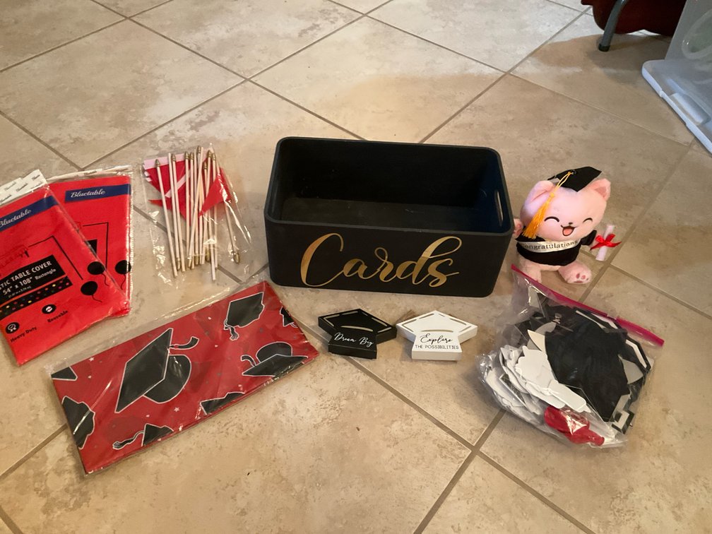 Grouping of graduation party decorations & supplies - Basement Living & Bar Area