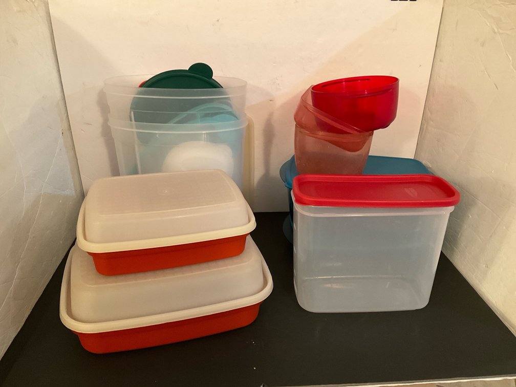 Grouping of plastic food storage containers & lids - Basement Living & Bar Area