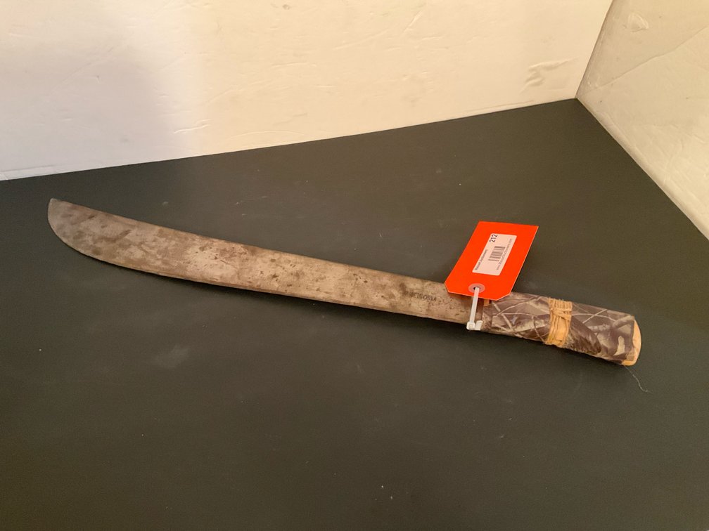 Machete with camouflage wrapped handle - Basement Living & Bar Area