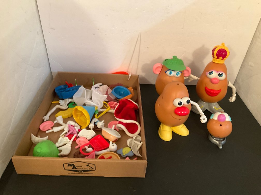 Grouping of 4 plastic toy potato figures with accessories - Basement Living & Bar Area