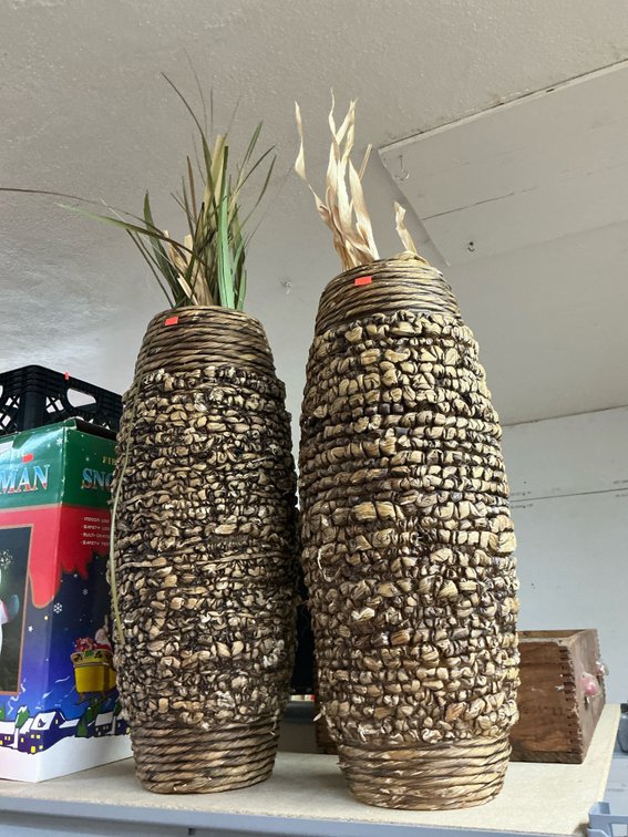 Pair of woven rope floor vases with dried foliage