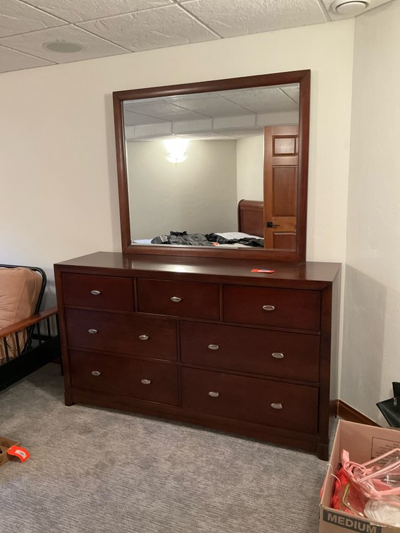 Dark wood 7-drawer dresser with attached mirror 66” x 20” x 38” - Basement Bedroom