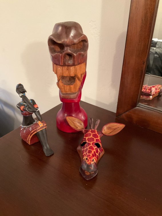 3 decorative sculptures with giraffe mask & figurine - Basement Bedroom