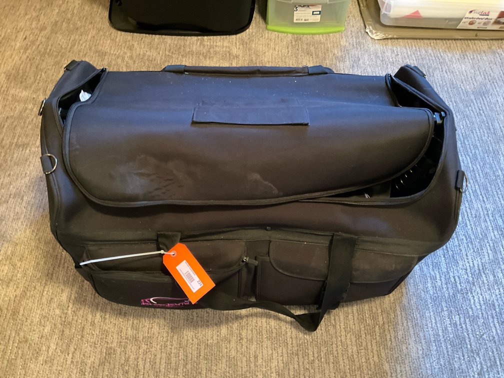 Dream Duffel rolling bag with extendable garment rack - Basement Bedroom