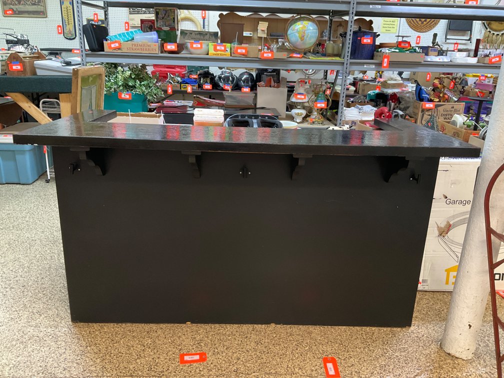 Black painted bar counter with textured top