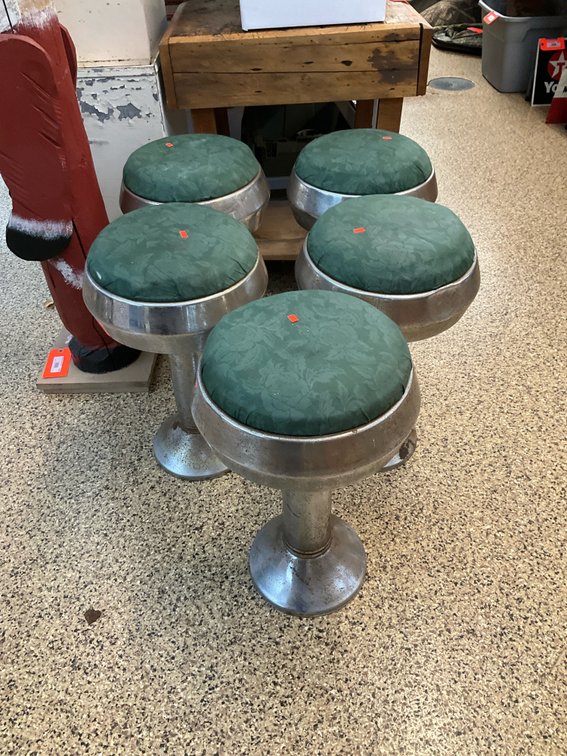 Set of 5 metal pedestal bar stools with green seats