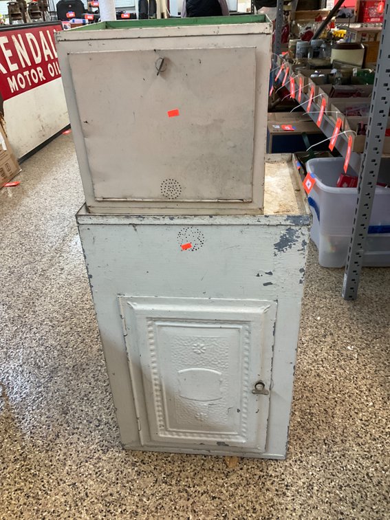 Pair of painted metal storage cabinets with vents