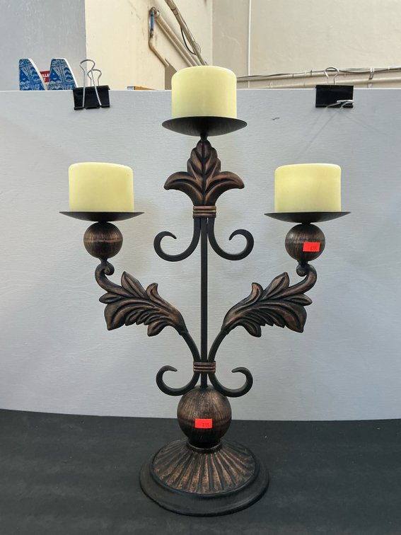 3-light metal candelabra with pillar candles