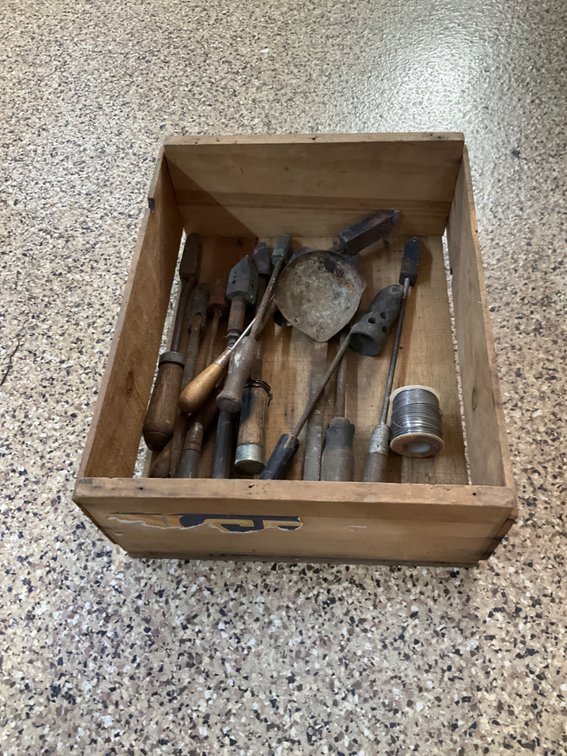 Grouping of soldering coppers, ladle & wooden crate