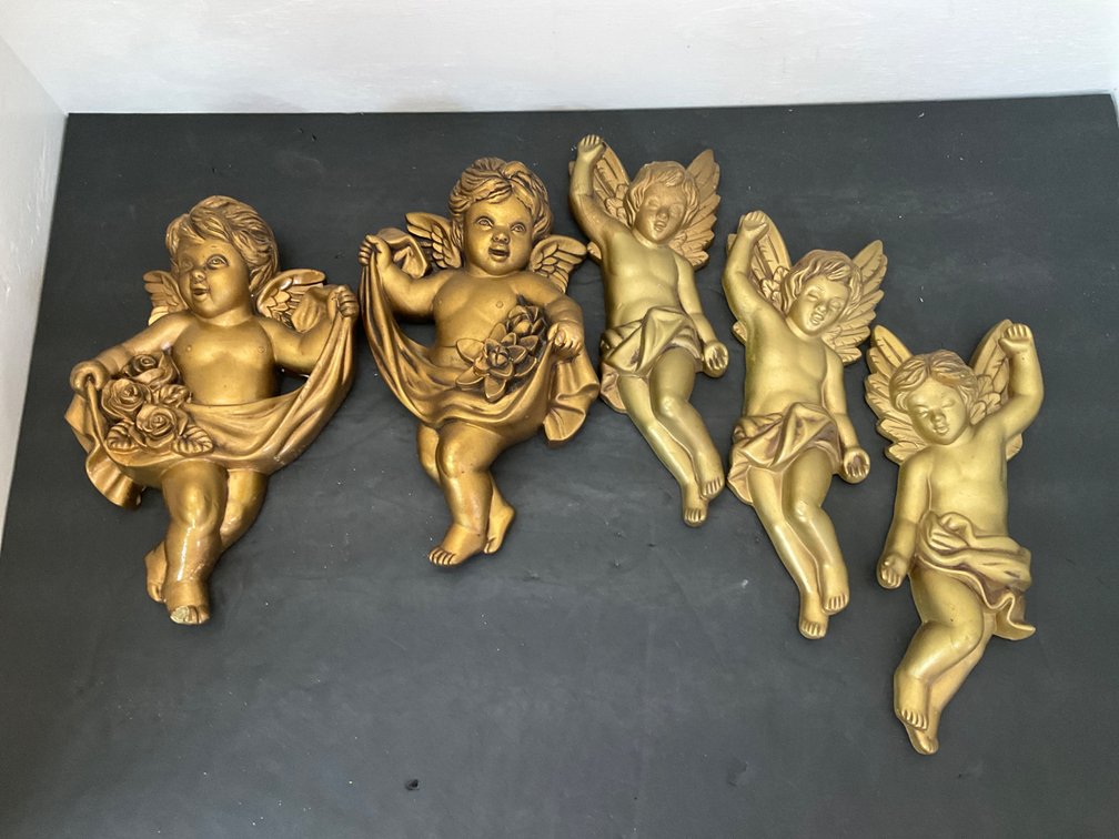 Set of gold-painted cherub wall plaques