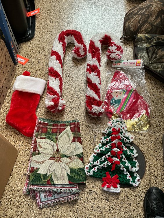 Grouping of Christmas tree skirts & holiday decor
