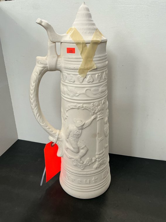 White unglazed ceramic relief lidded beer stein