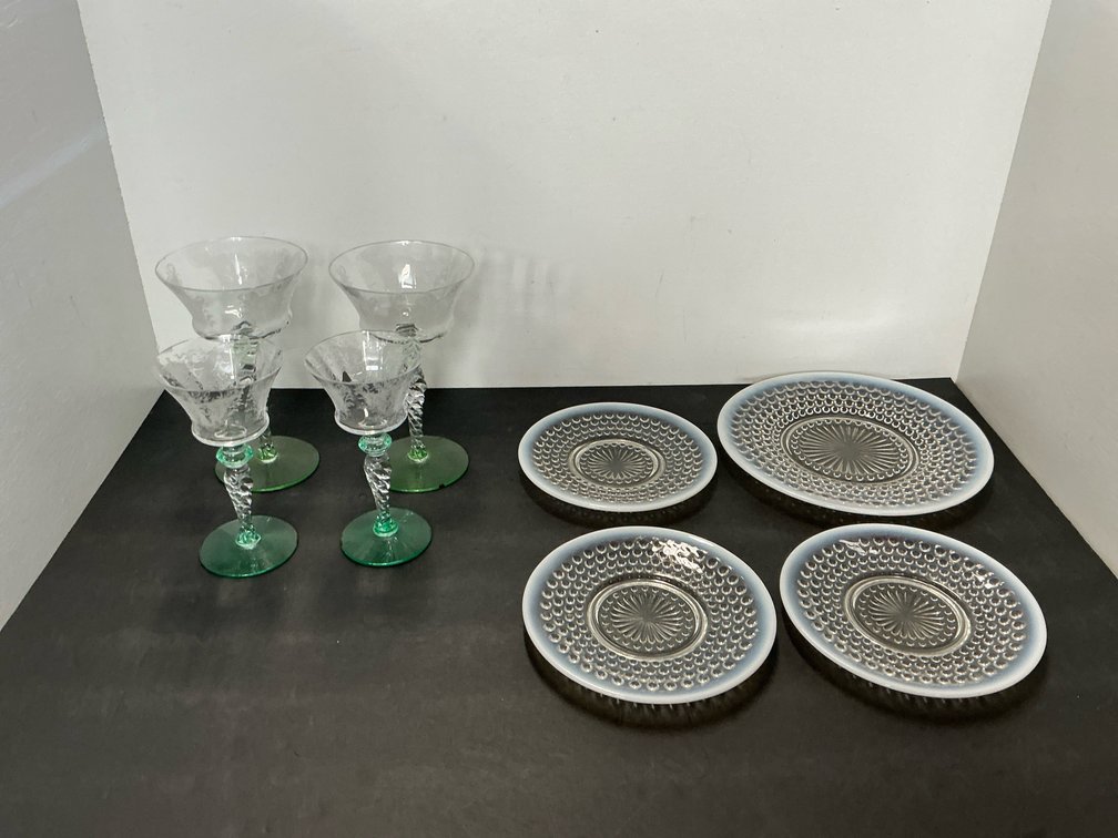 Group of etched coupe glasses with green bases