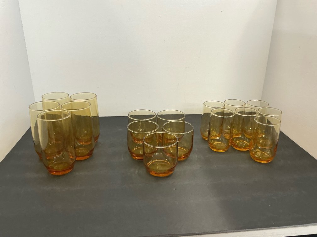 Group of amber glass tumblers and glasses