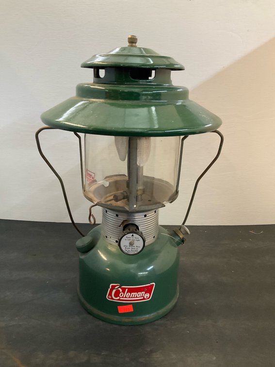 Coleman green camping lantern with glass globe