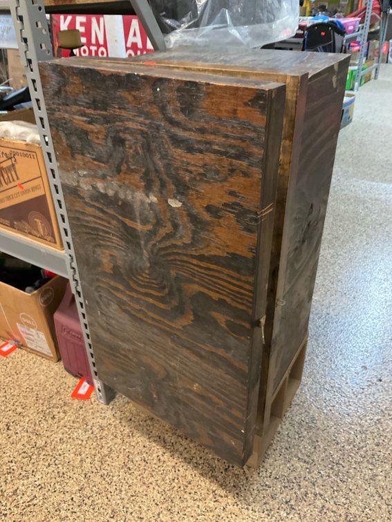 Dark-stained plywood storage cabinet with latch