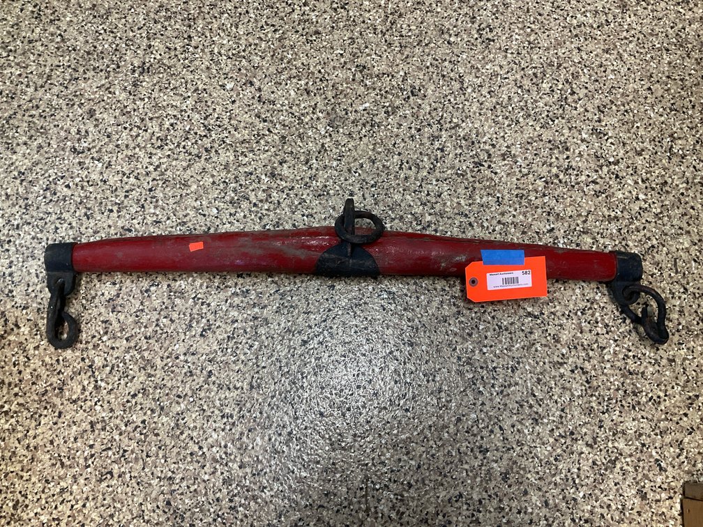Red painted wooden singletree with iron hardware