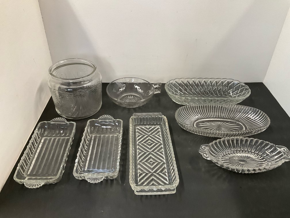 Group of clear pressed glass serving dishes & jar