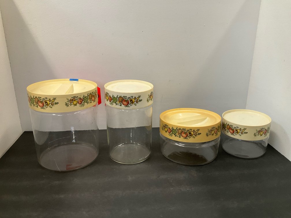 Set of 4 Pyrex glass canisters with fruit pattern lids