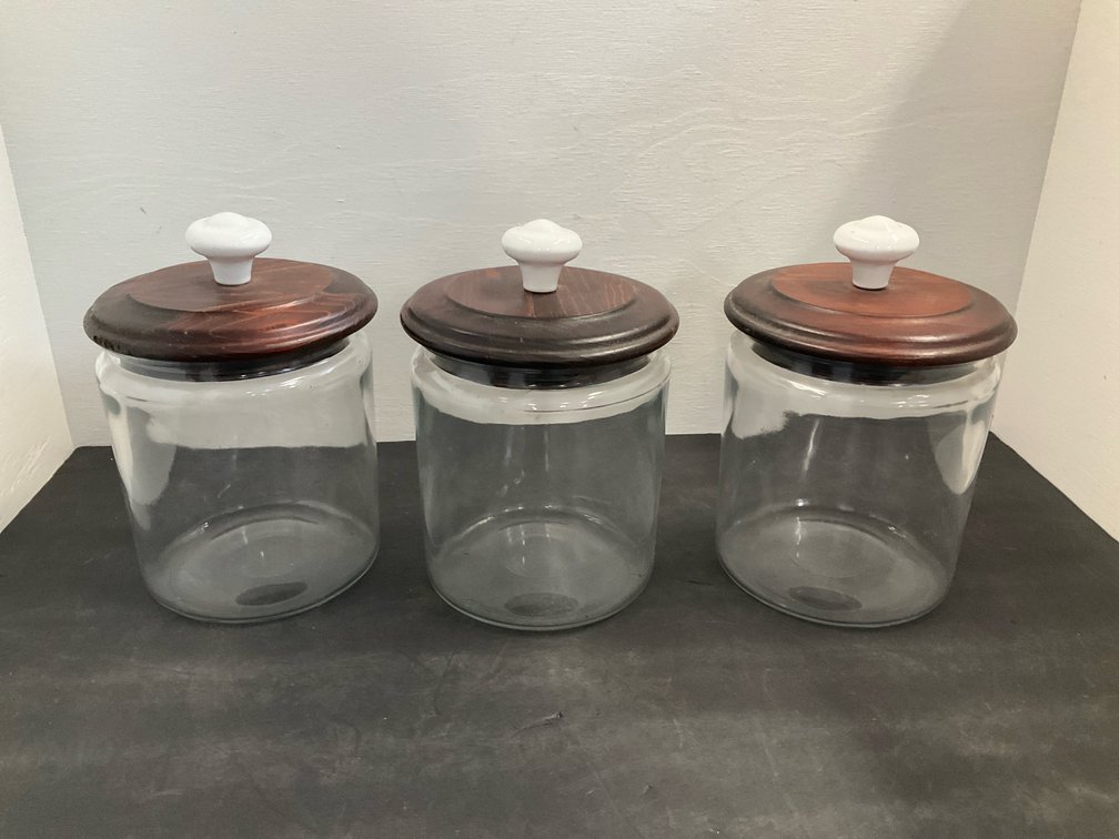 Group of glass canisters with wood lids & ceramic knobs