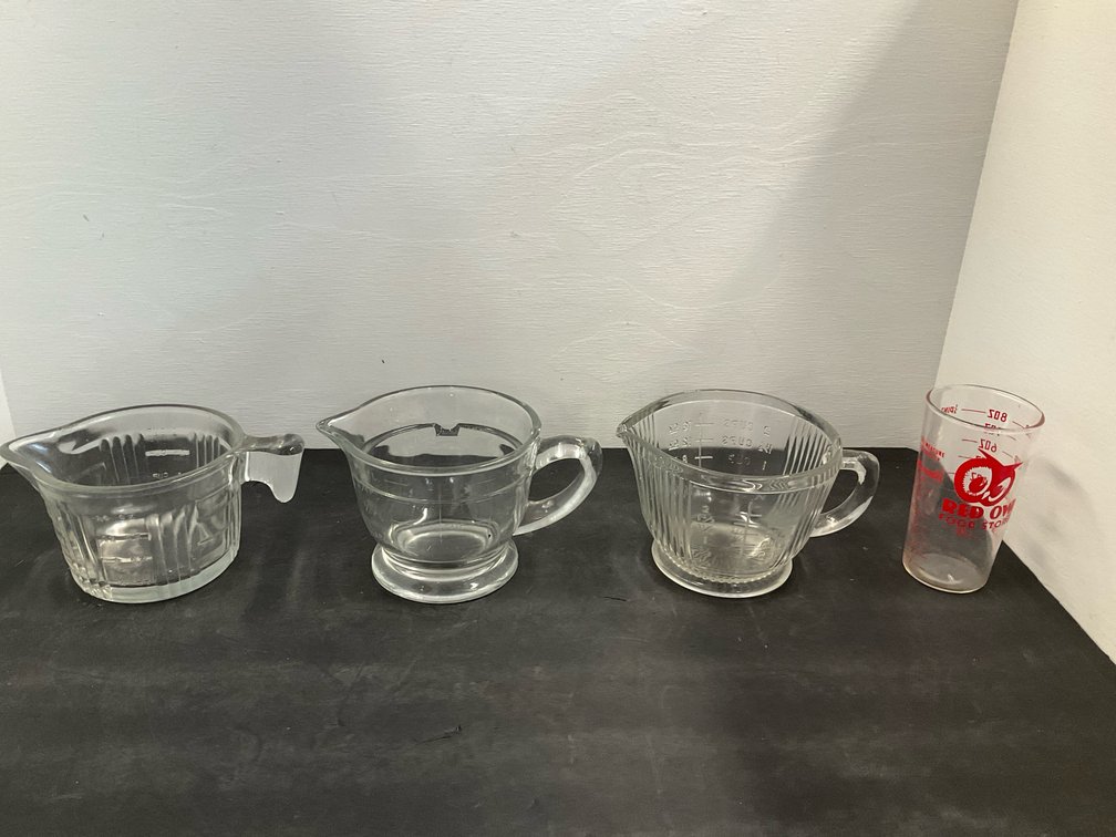 Group of clear glass measuring cups & pitchers