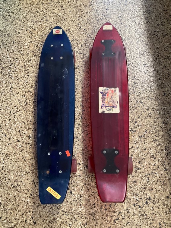 Pair of Nash blue & red plastic skateboards