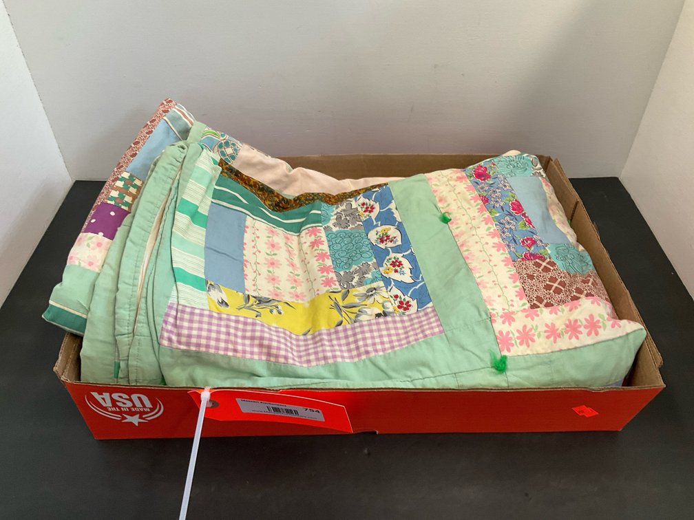 Patchwork tied quilt with light green border