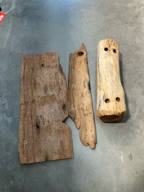 Rustic weathered wood planks & drilled log