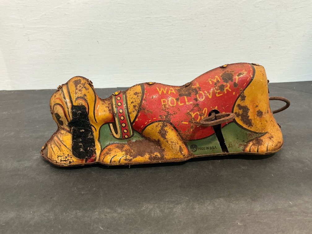 Walt Disney Productions Pluto tin wind-up rollover toy