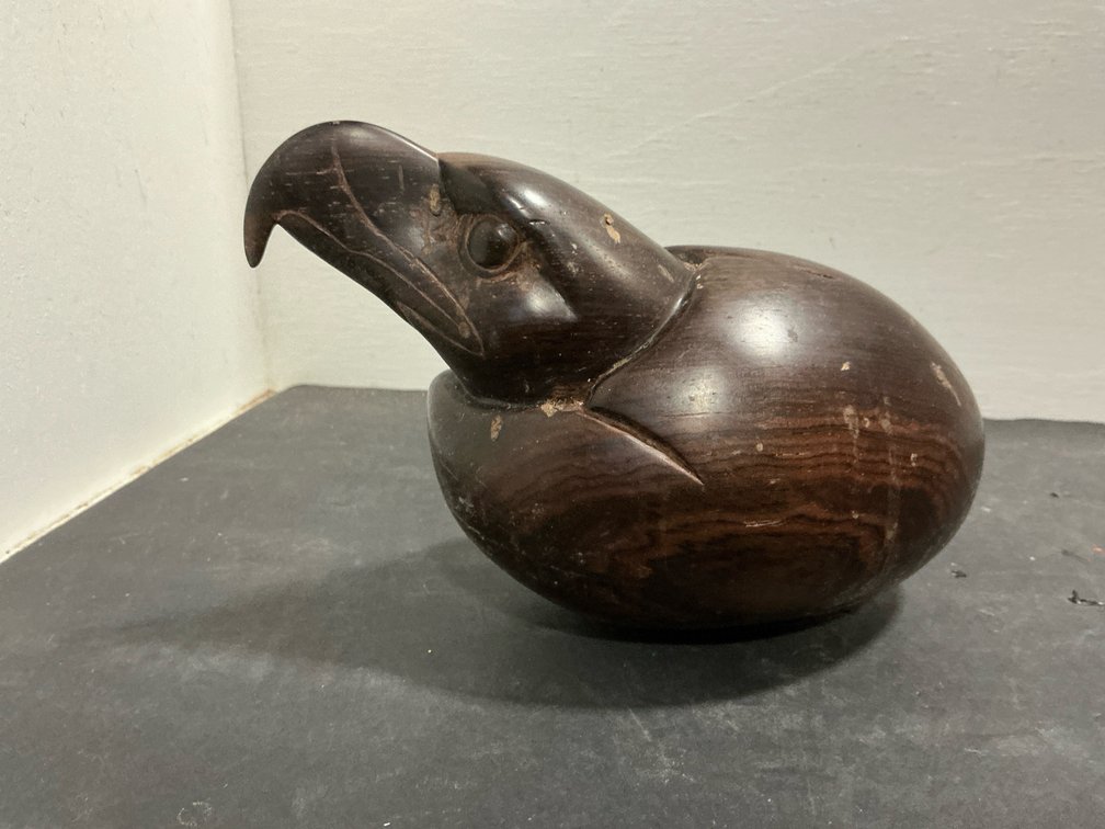 Carved dark wood stylized bird sculpture